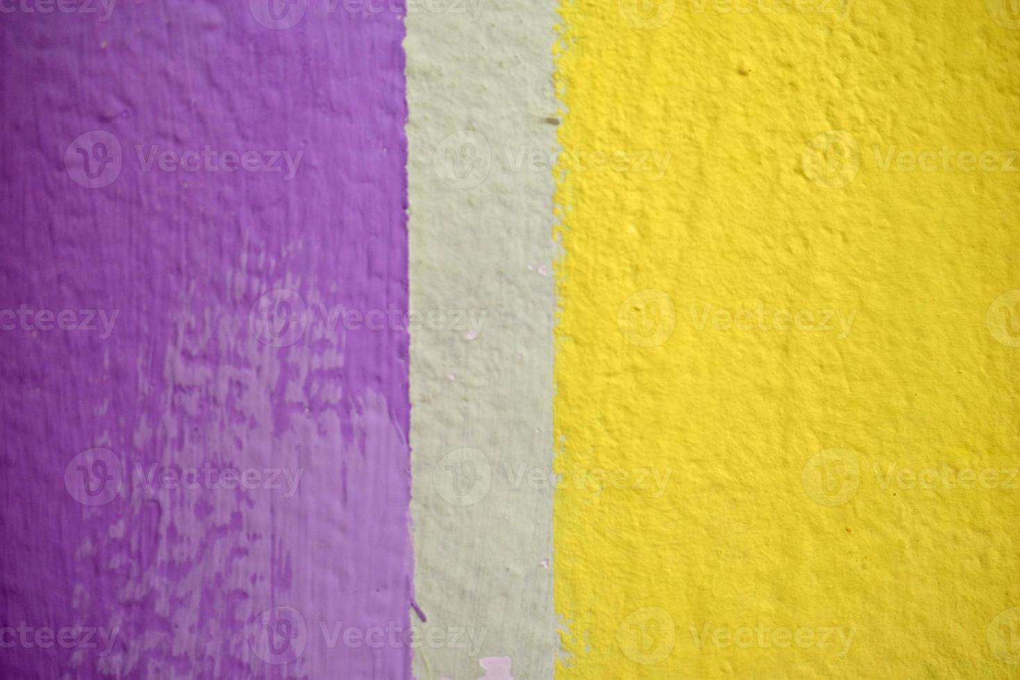 Colored painted wall with stripes. Wall art object with multicolored objects. photo