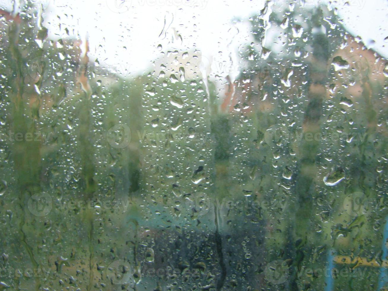 rainy days rain drops on the window surface photo