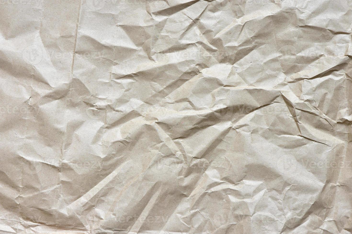 beige crumpled craft paper background photo