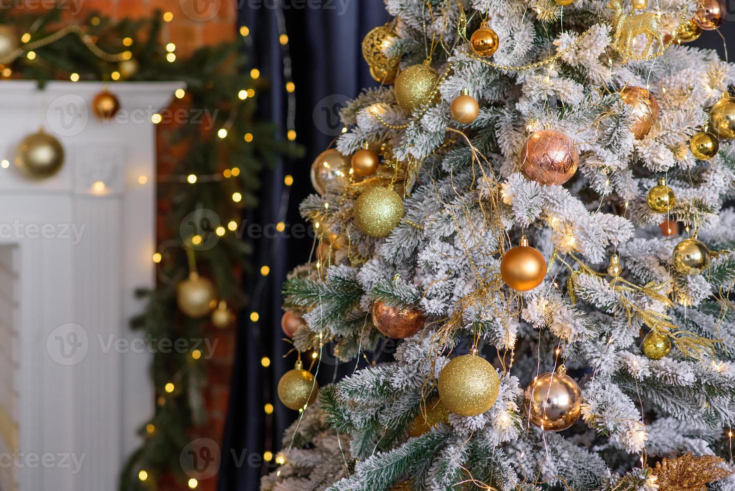 Beautiful Christmas tree with garlands, balls and toys photo