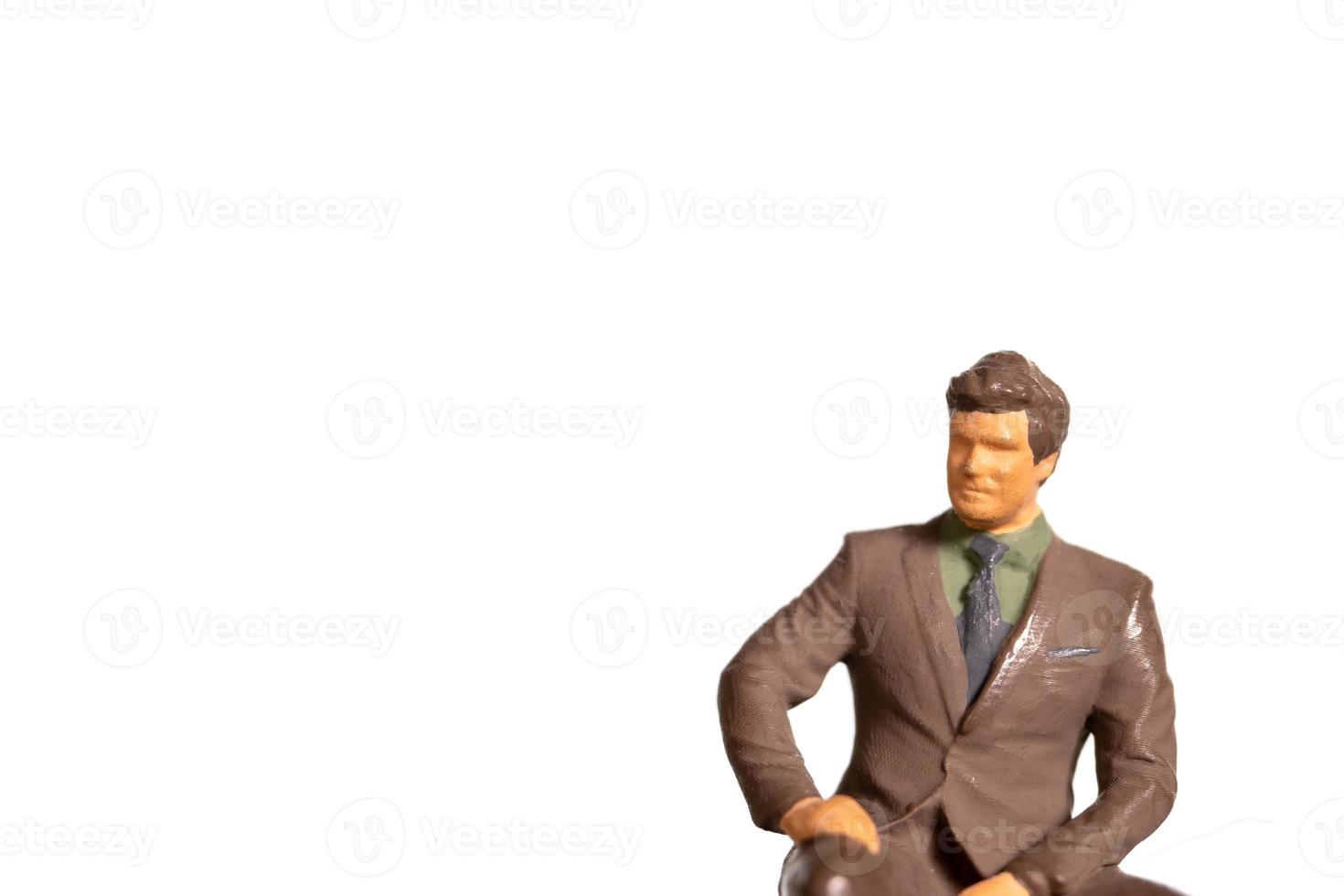 Miniature Businessman on white background And space for text photo