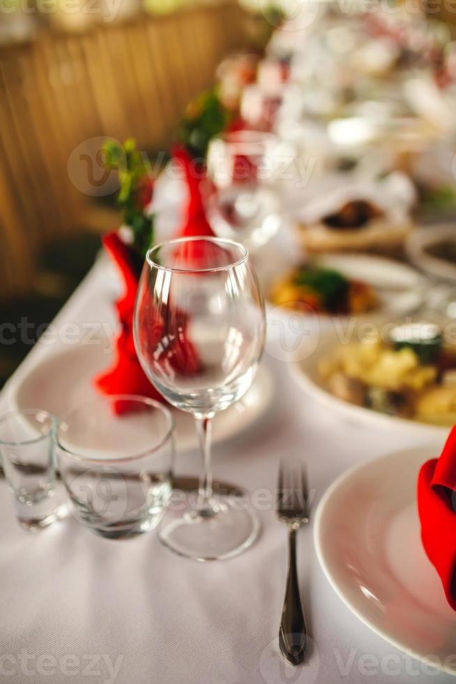 Restaurant interior, serving, wine and water glasses, plates. Concept banquet, birthday, conference, group lunch photo