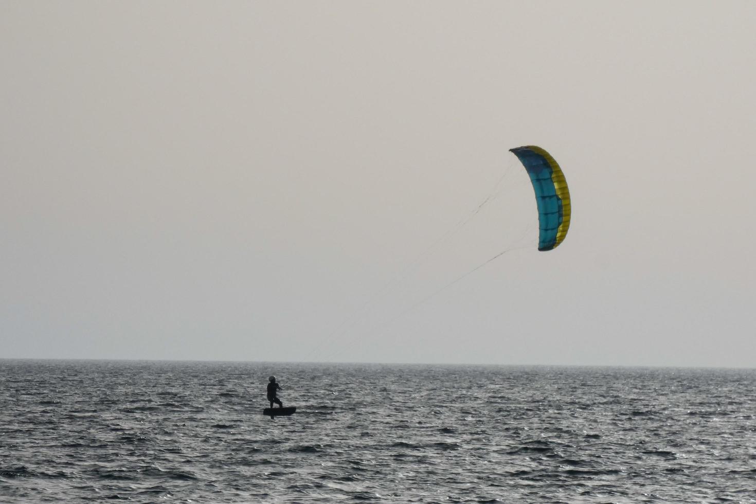 windsurfing, kitesurfing, water and wind sports powered by sails or kites photo