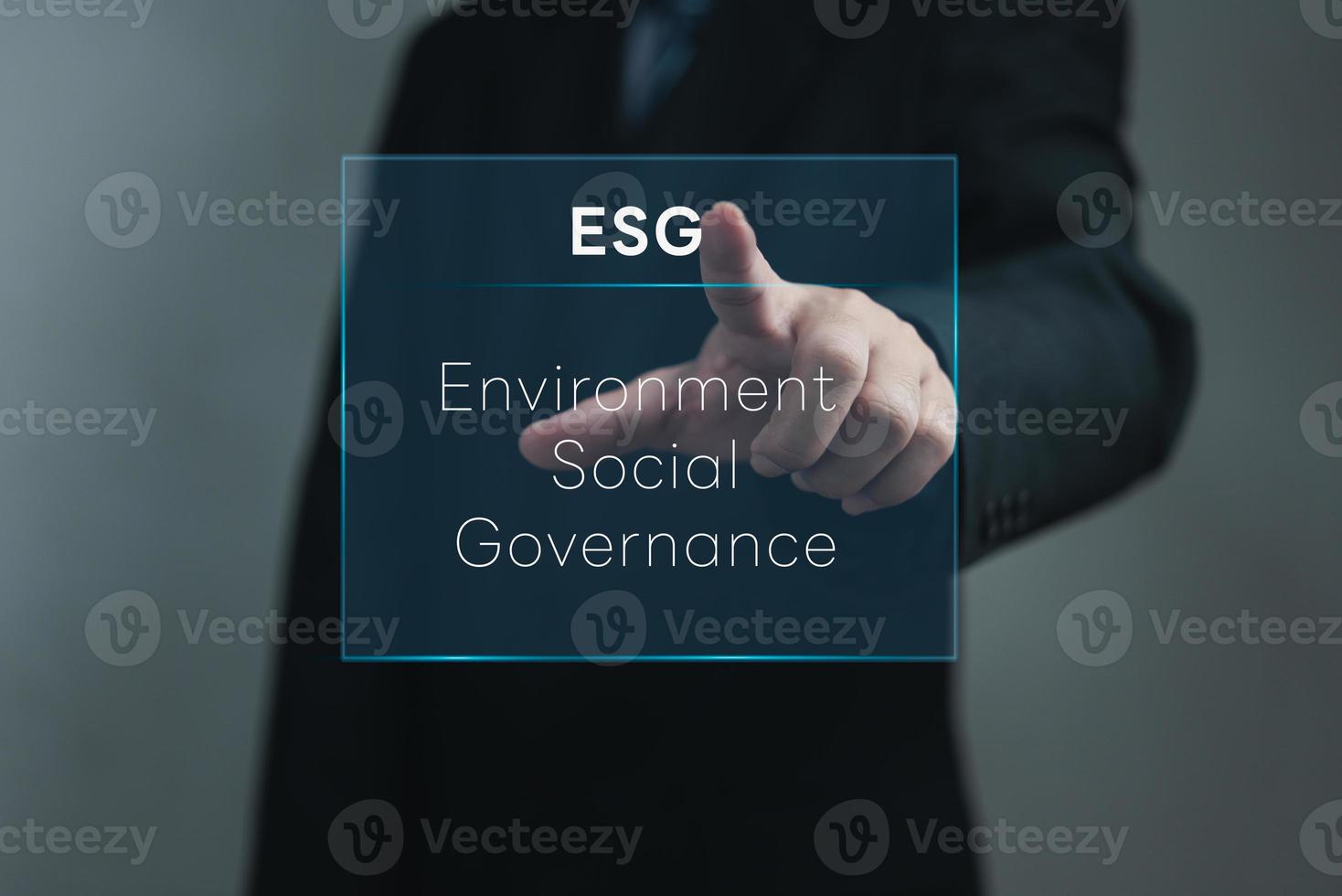 Businessman touching screen virtual icon ESG Environmental social and governance eco energy sustainable digital investment Organizational growth technology concept. photo