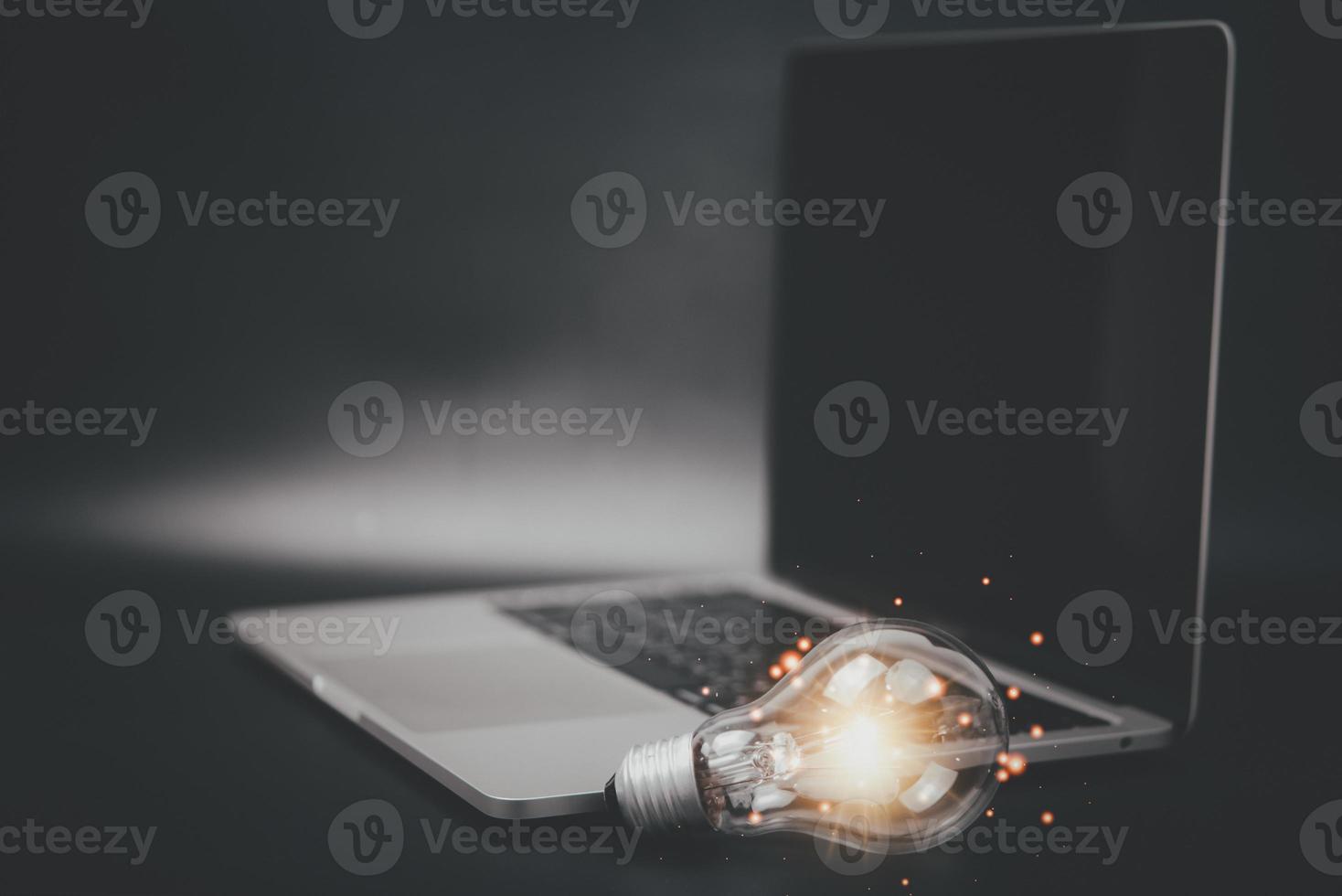 light bulb with laptop computer photo