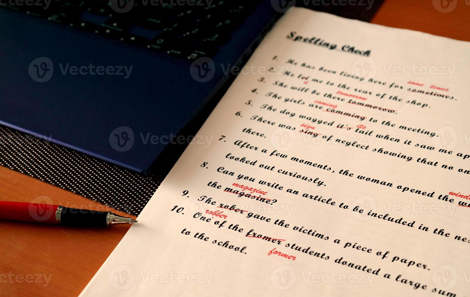 spelling check paperwork with red mark photo