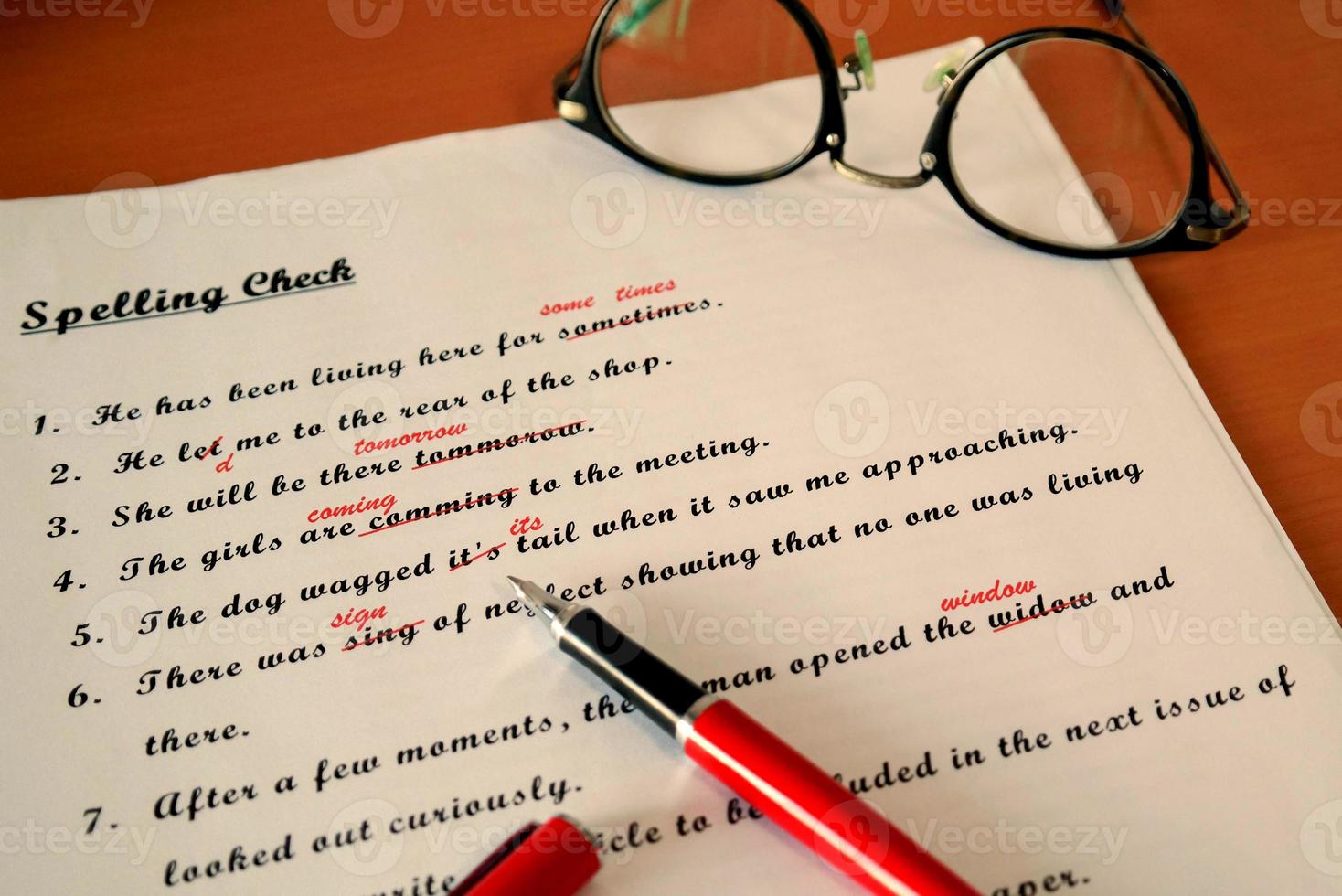 spelling check paperwork with red mark photo