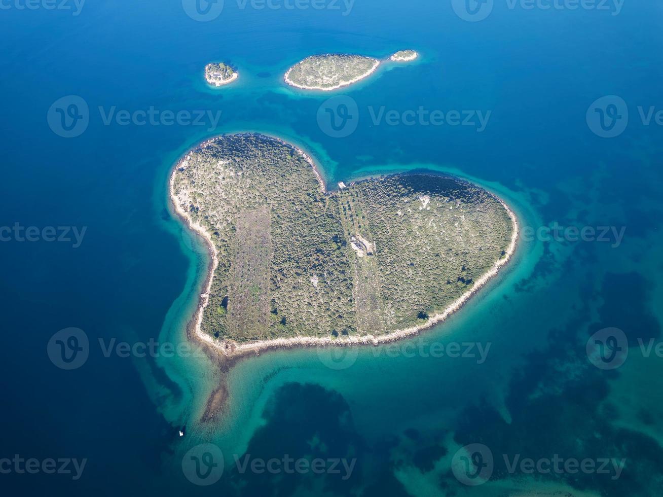 Aerial drone view of Galesnjak the Island of Love in Croatia with beautiful blue turquoise sea water. Heart shaped Island. Travel and holidays destination. Amazing tourism in Croatia Islands. photo