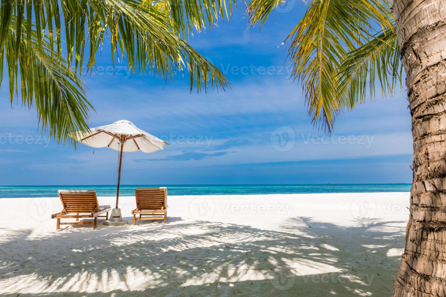 Beautiful tranquil beach. Chairs on the sandy beach near the sea. Summer holiday and vacation concept for tourism. Inspirational tropical landscape, boost up color process. Exotic travel destination photo