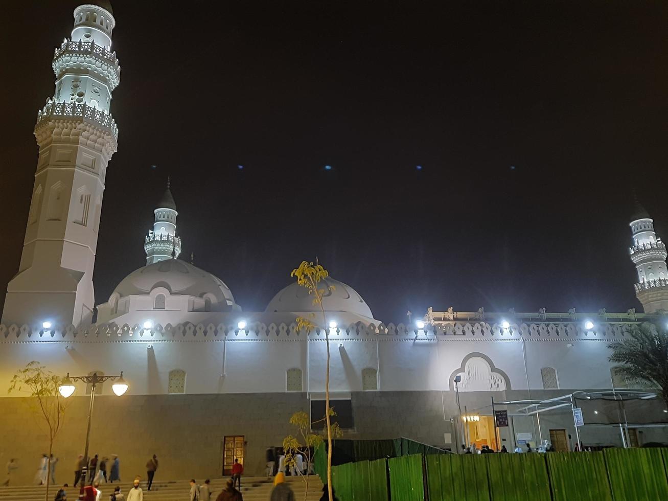 Medina, Saudi Arabia, Dec 2022 - A beautiful view of the minarets and dome of the Quba Mosque in Medina, Saudi Arabia at night. photo
