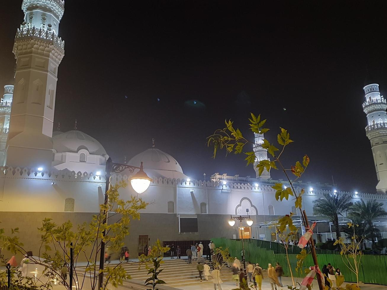 Medina, Saudi Arabia, Dec 2022 - A beautiful view of the minarets and dome of the Quba Mosque in Medina, Saudi Arabia at night. photo