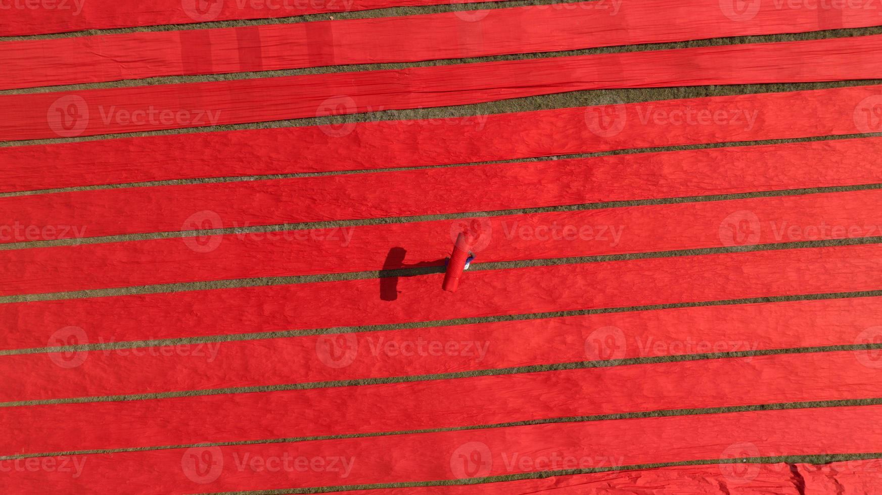 Drying red fabric in Bangladesh photo