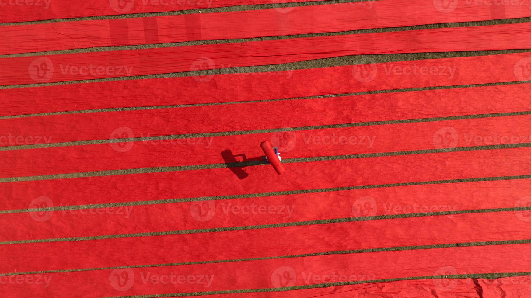 Drying red fabric in Bangladesh photo