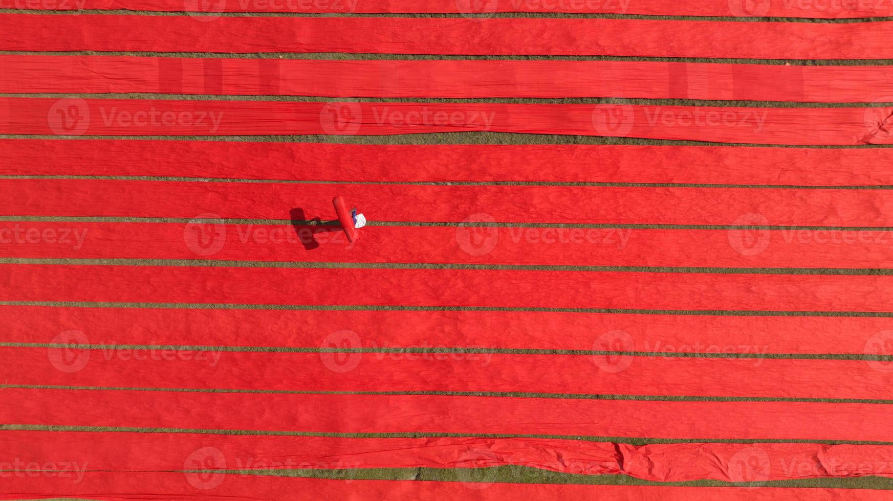 Drying red fabric in Bangladesh photo