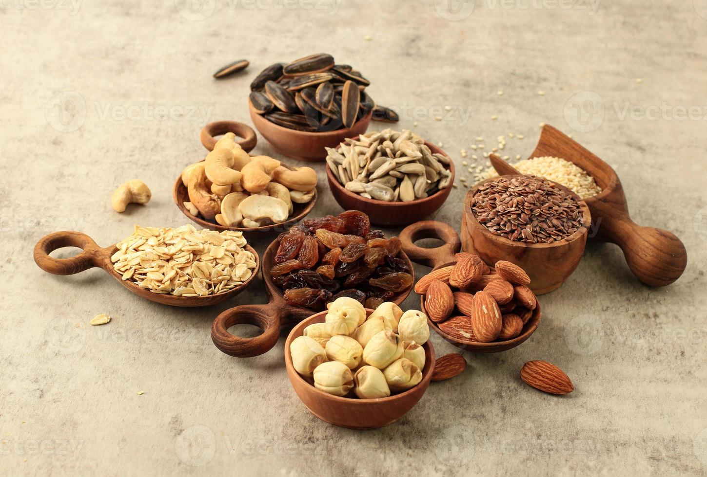 Various Nuts, Seed, Raisin on Wooden Bowl, photo