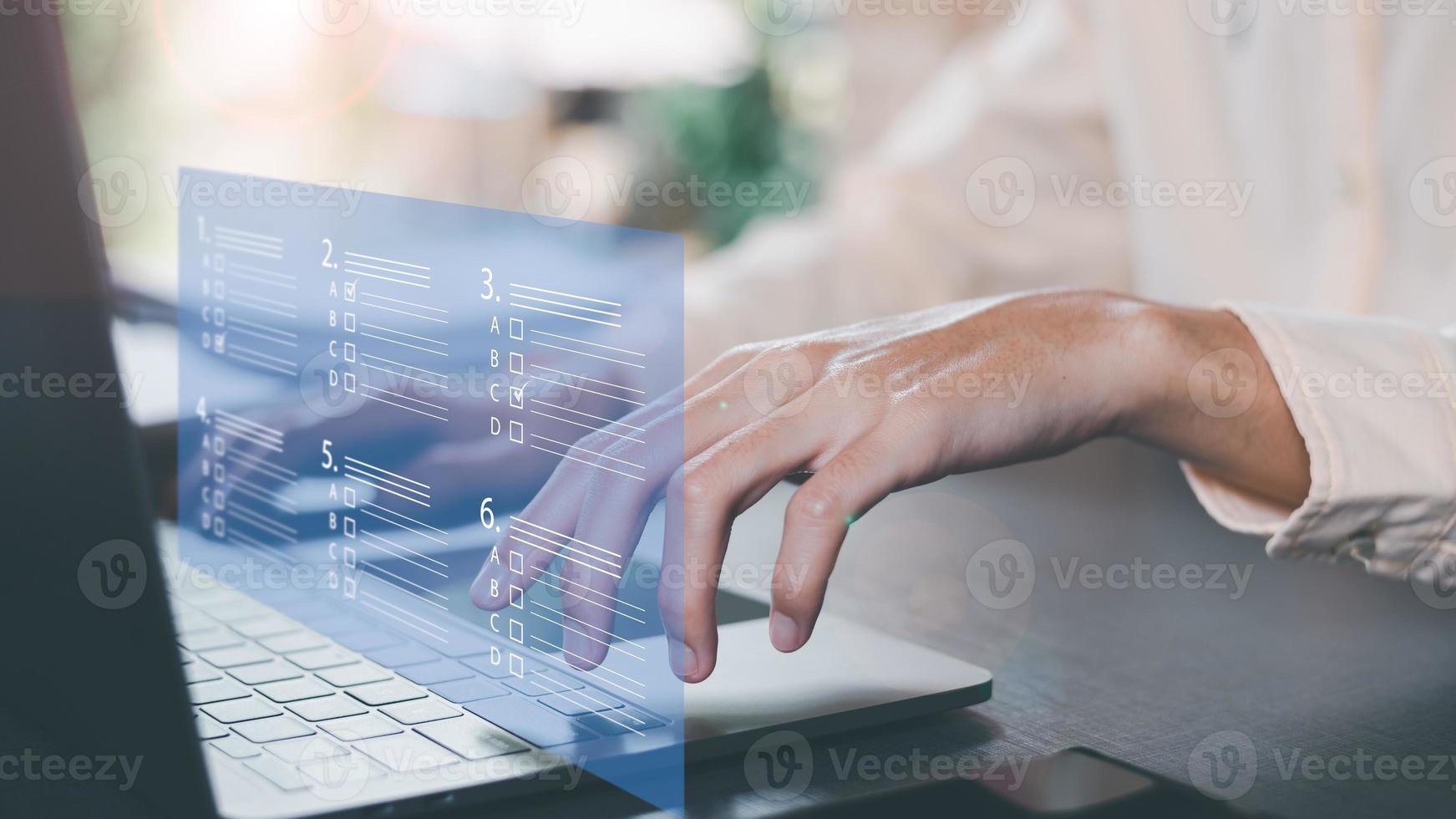 The man chooses the correct answer, marking online,online survey concept online exam filling out survey forms,using technology for education,learning assessment through online documents photo