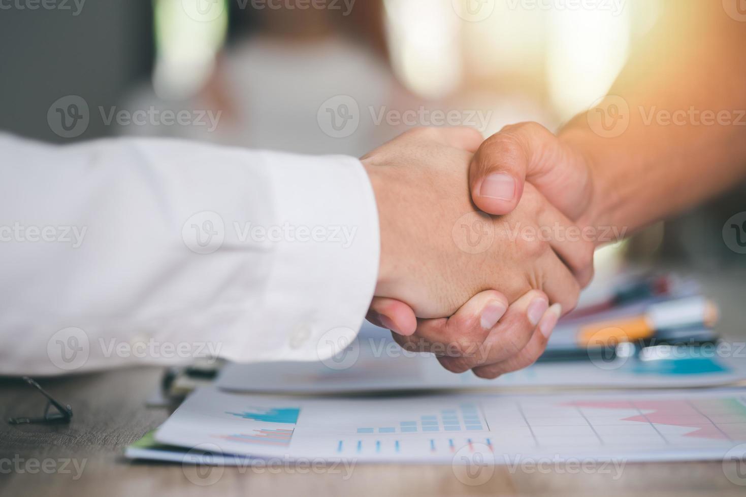 business people shaking hands indicating agreement business,concept progress in development, financial efficiency and investment with business strategy for goals and opportunities in industry future photo