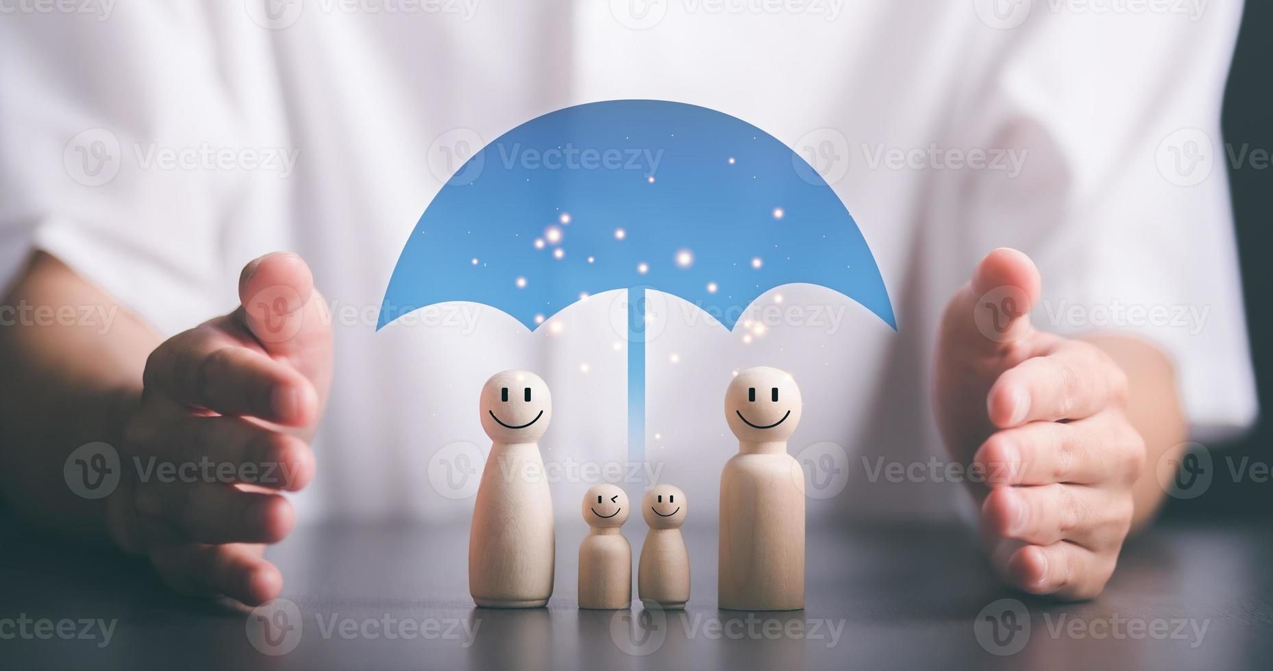 wooden dolls and icons represents the protection and protection of safety,concept of insurance management planning To ensure both health and financial safety,Property and Family Risk Reduction photo