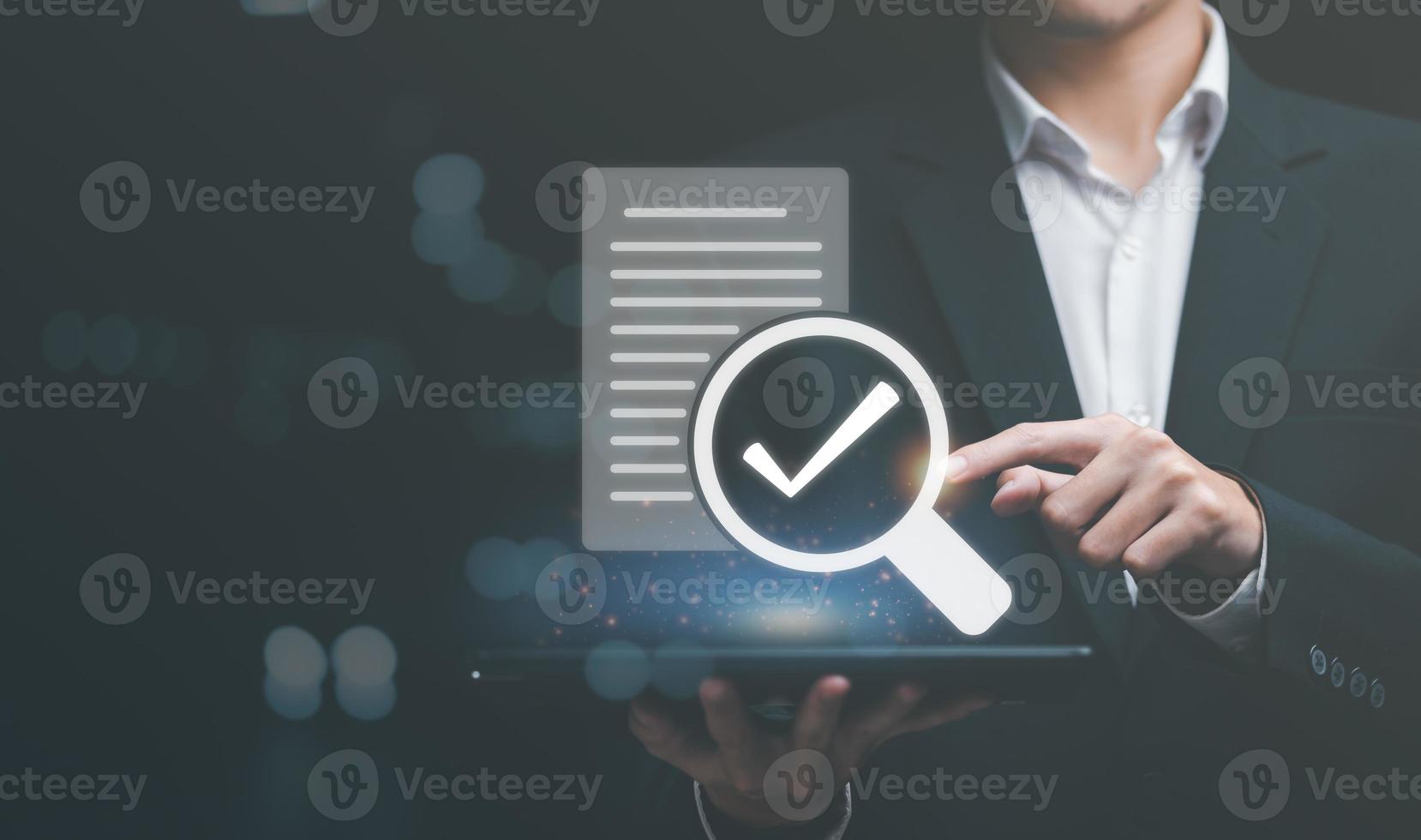 businessman holding and magnifying glass icon,Show audit documents That is correct according to rules and regulations,quality assessment management With checklist, business document evaluation process photo