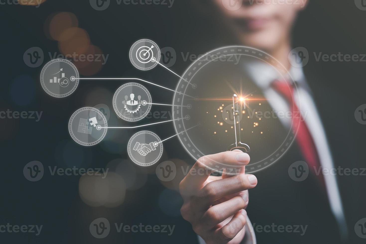 solution concept and demonstrating leadership strategies,that lead the business in a successful direction,with innovation and brain power from brainstorming,businessman holding a key photo