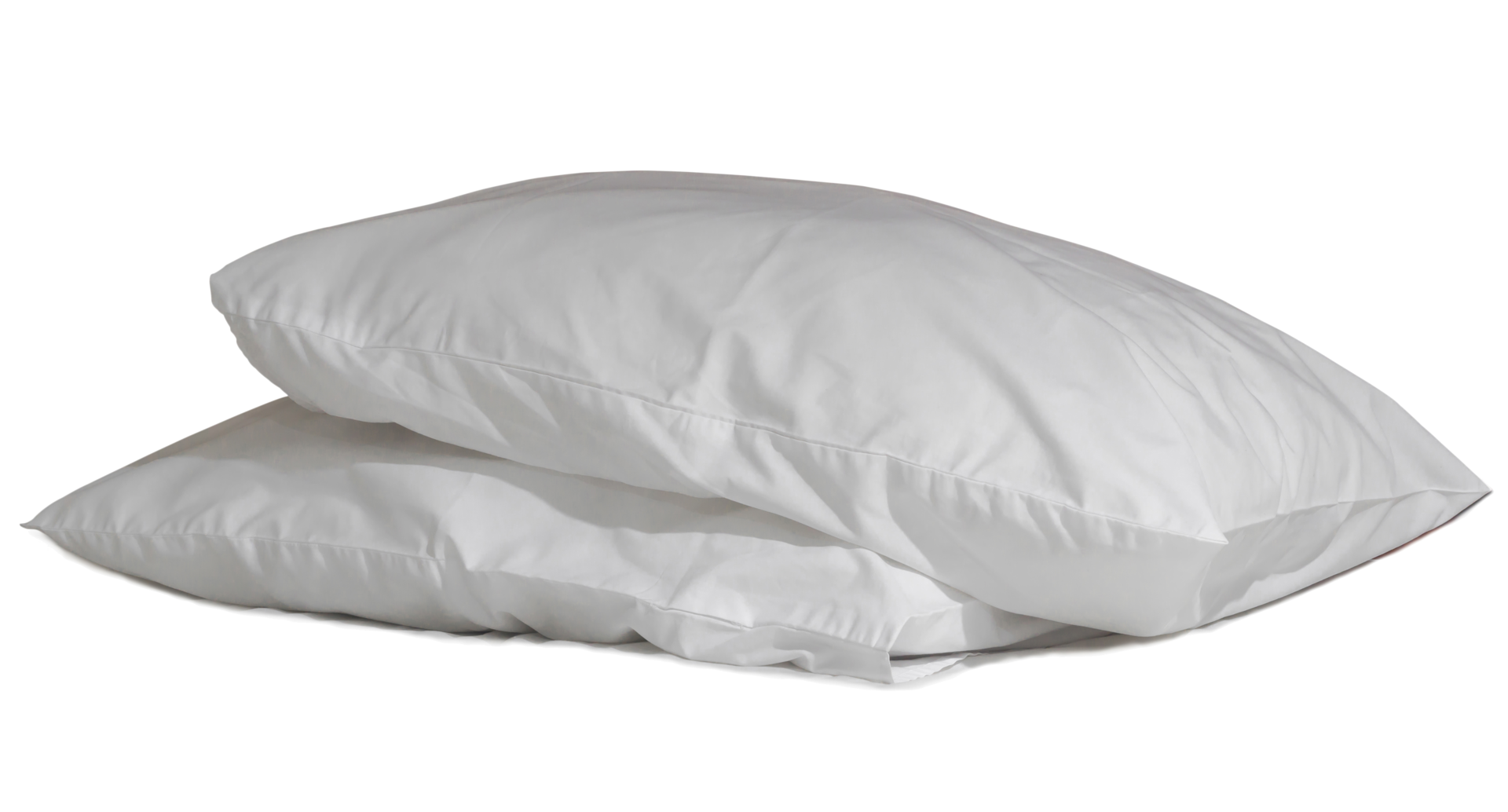 Two white pillows with cases after guest's use at hotel or resort room