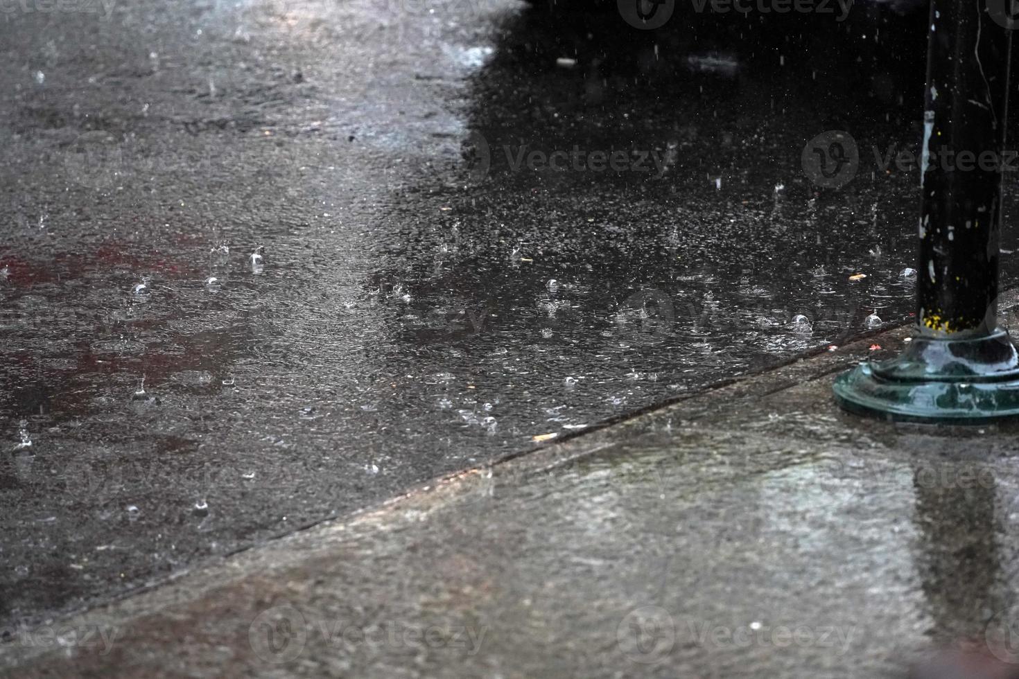 heavy rain in chinatown new york city on the street photo