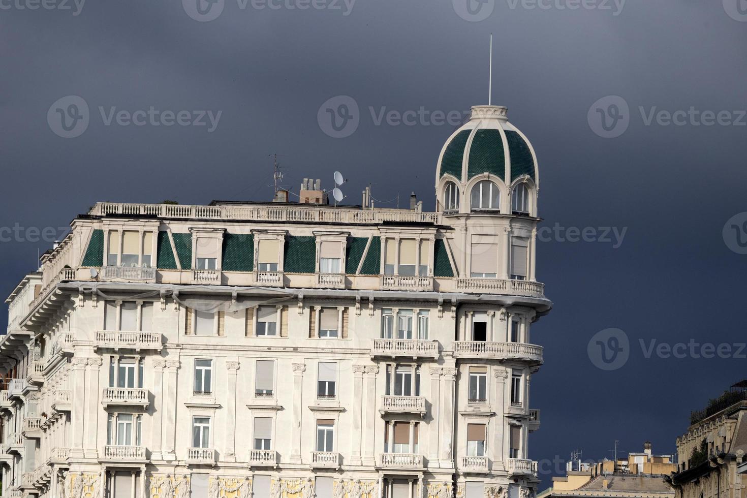 genoa town cityscape panorama from the sea harbor photo