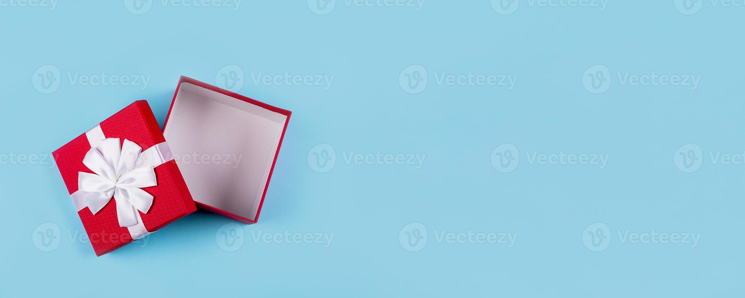 Open red gift box. Top view, flat lay. Mockup, holiday concept. Banner image for website, design photo
