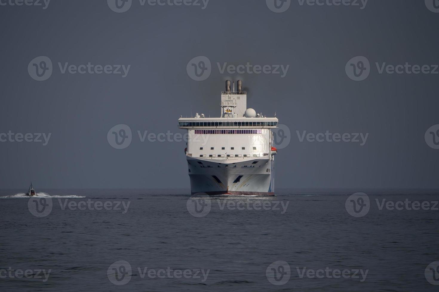 ferry ship frontal view while entering harbor photo