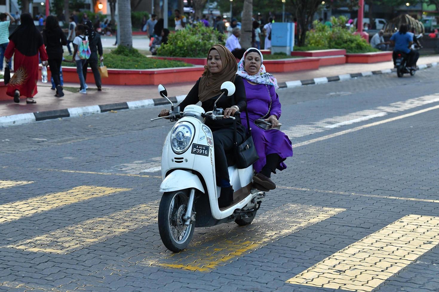 MALE, MALDIVES - FEBRUARY 17 2018 - Heavy traffic in the street before evening pray time photo
