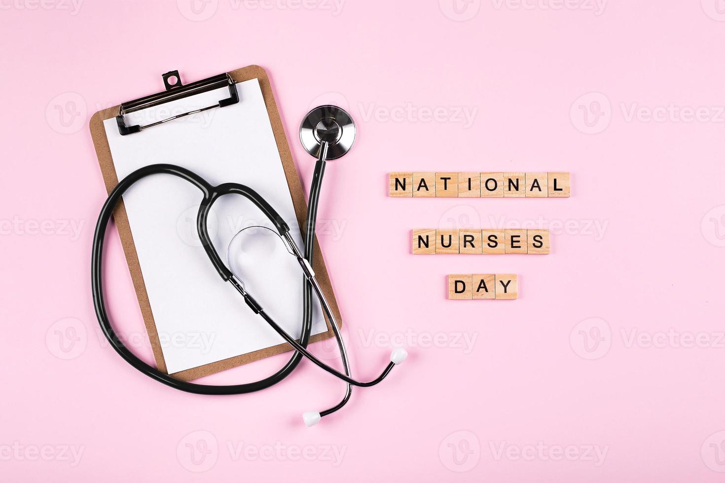 National Nurse Day Holiday Background. Medical stethoscope, white clipboard notebook photo