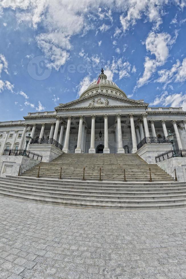 Full Washington DC Capitol on cloudy sky photo