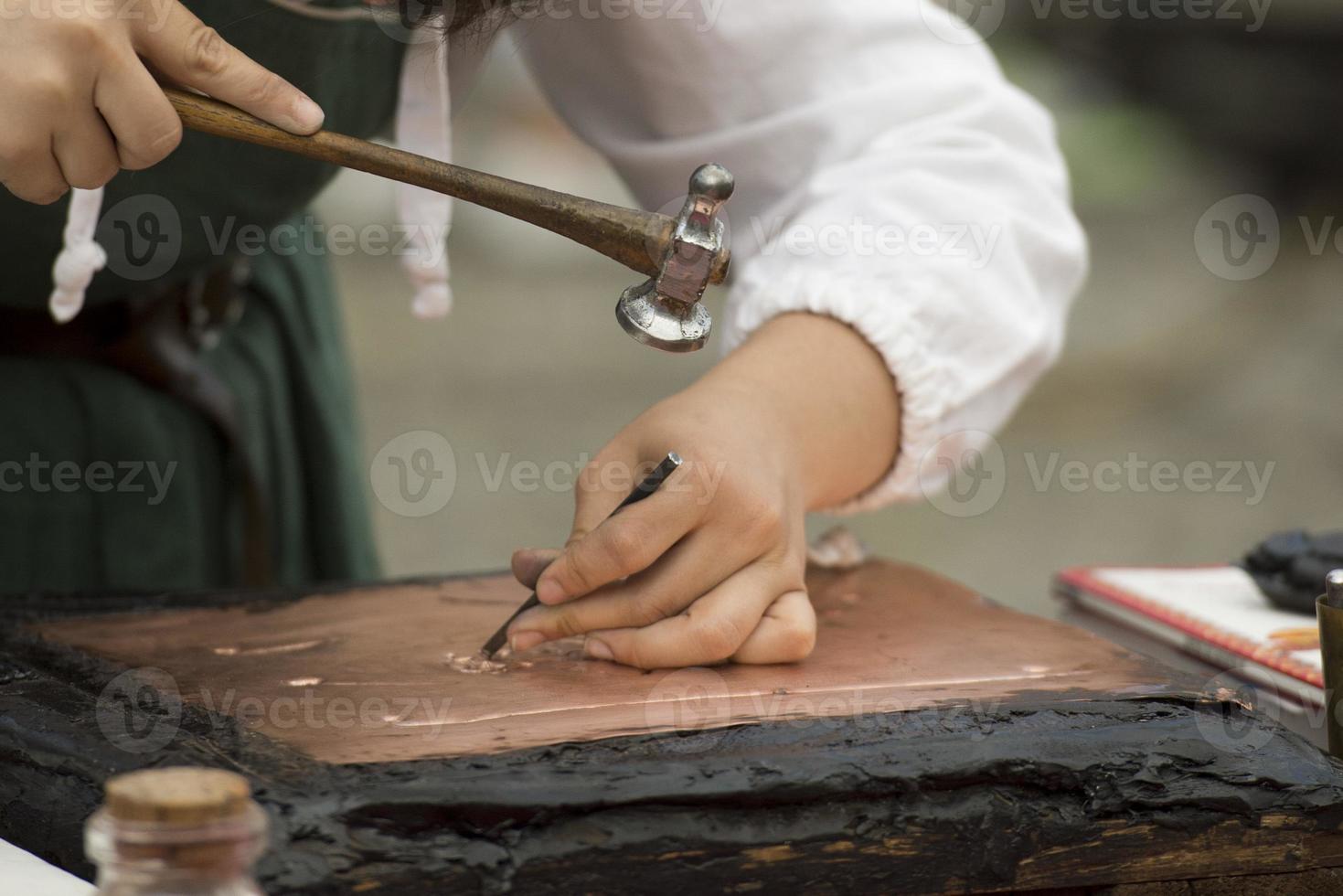 hands working copper photo
