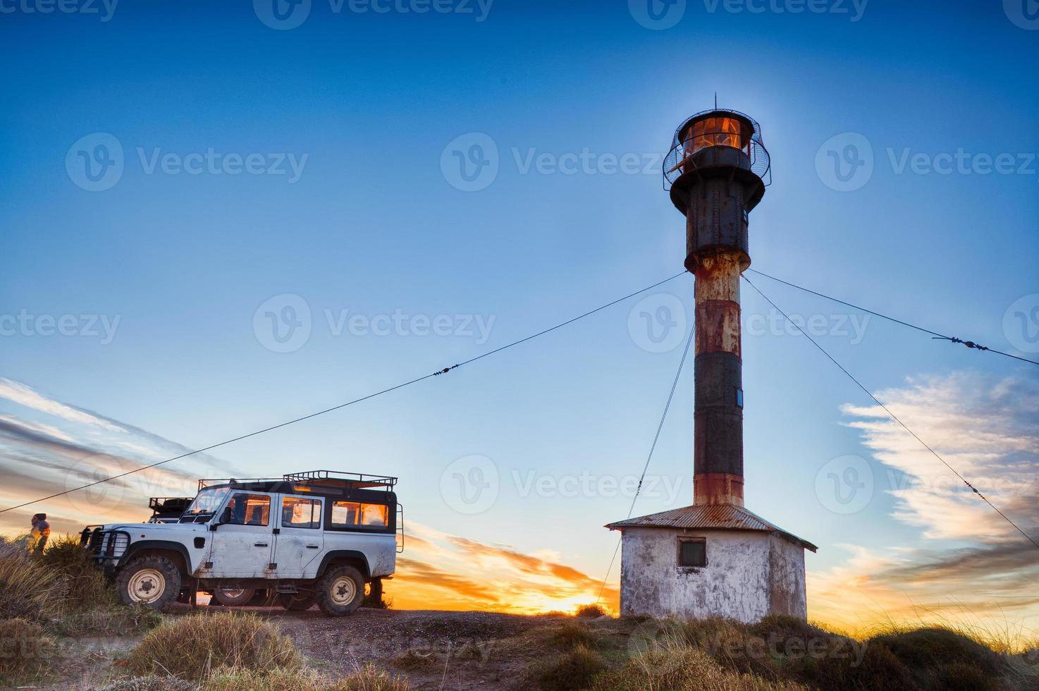 Car outside patagonia lighthouse in valdes peninsula photo