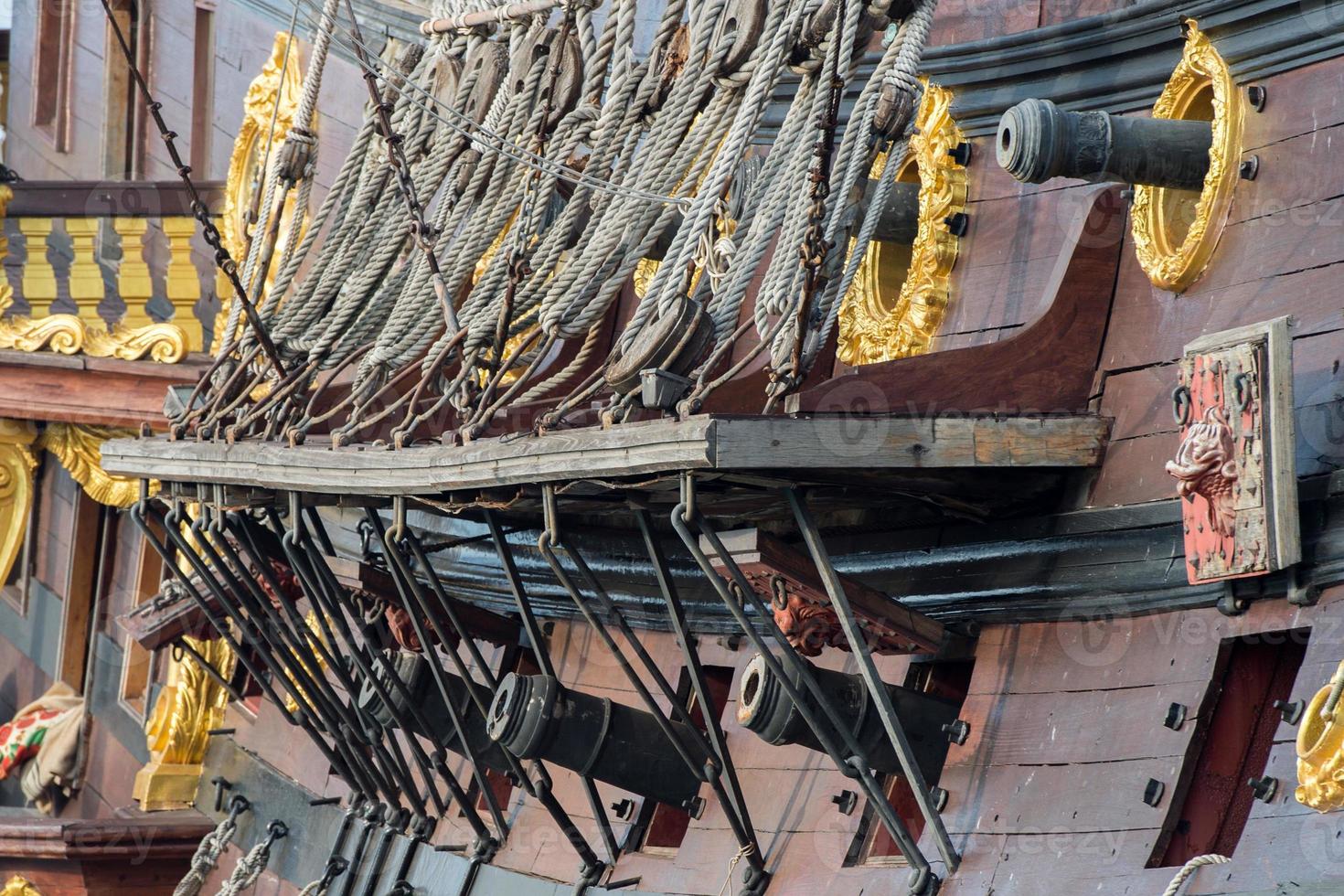 iron cannon on sail ship photo