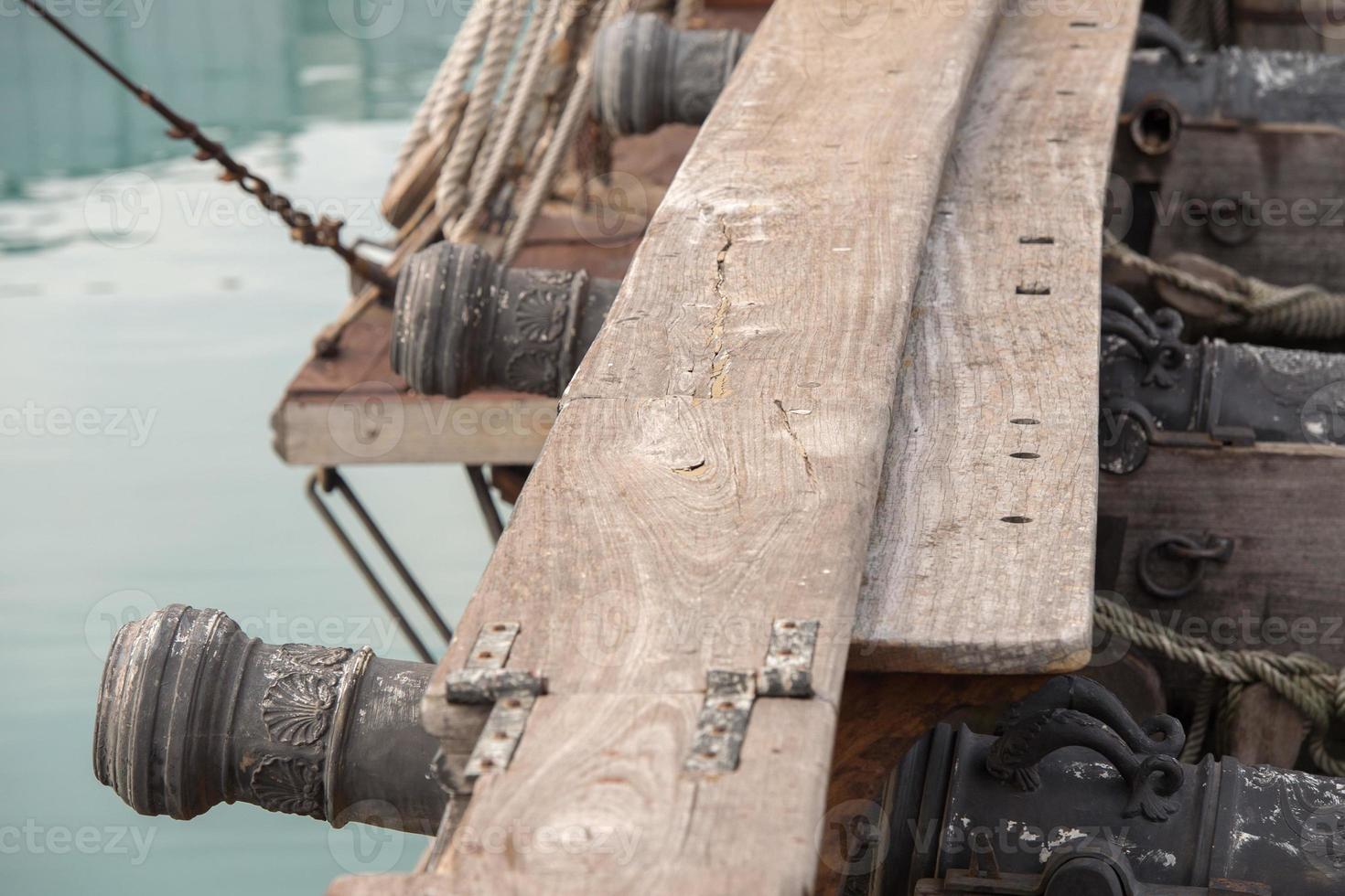 iron cannon on sail ship photo