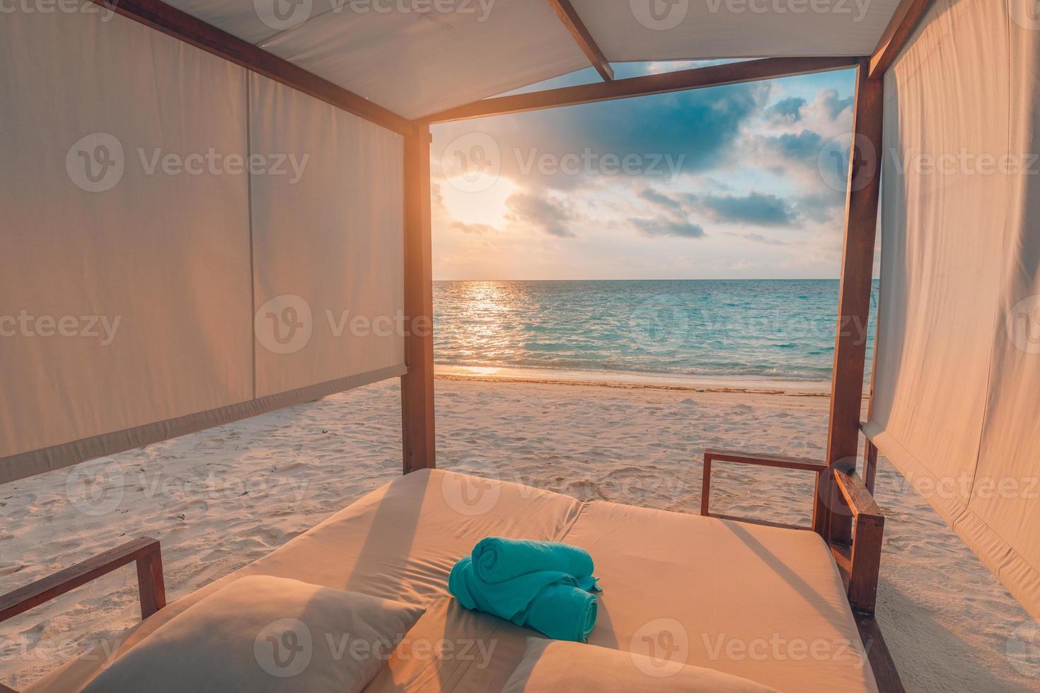 Amazing beach canopy with summer vacation mood. Sunset colors, sea sand sky beach concept with endless sea view. Beautiful tropical landscape, luxury resort or hotel background as travel destination photo