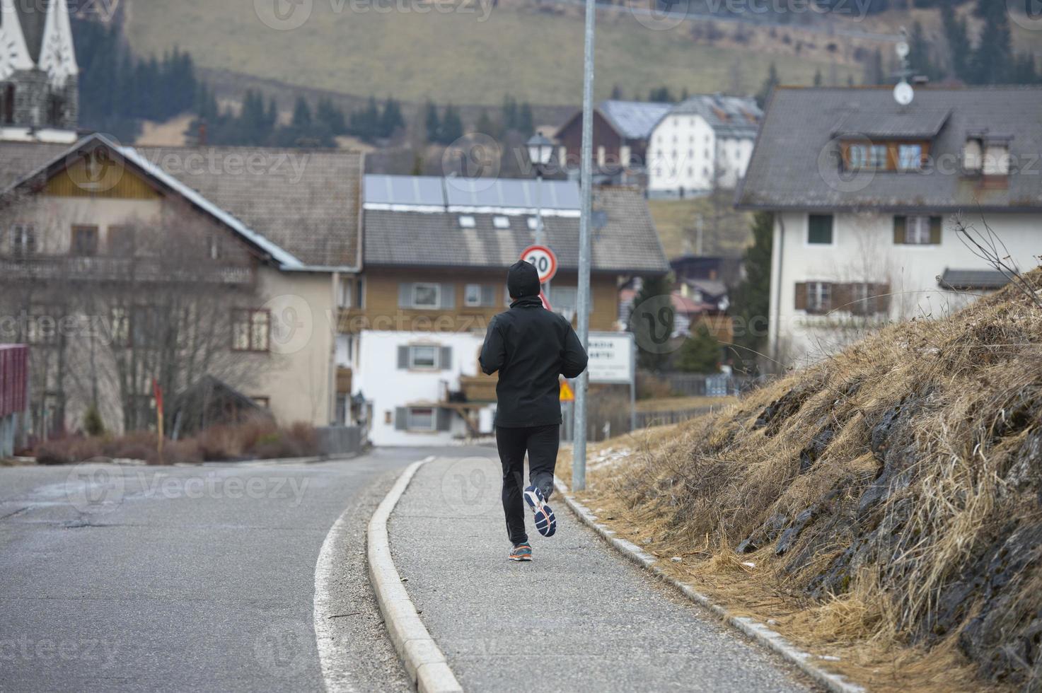 man running in mountain road photo