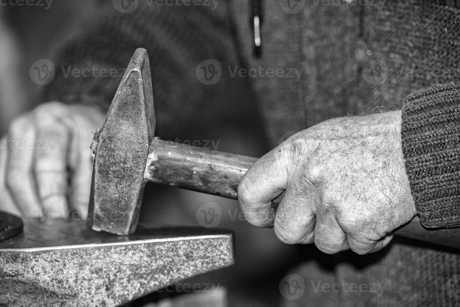 old retired man hands working photo