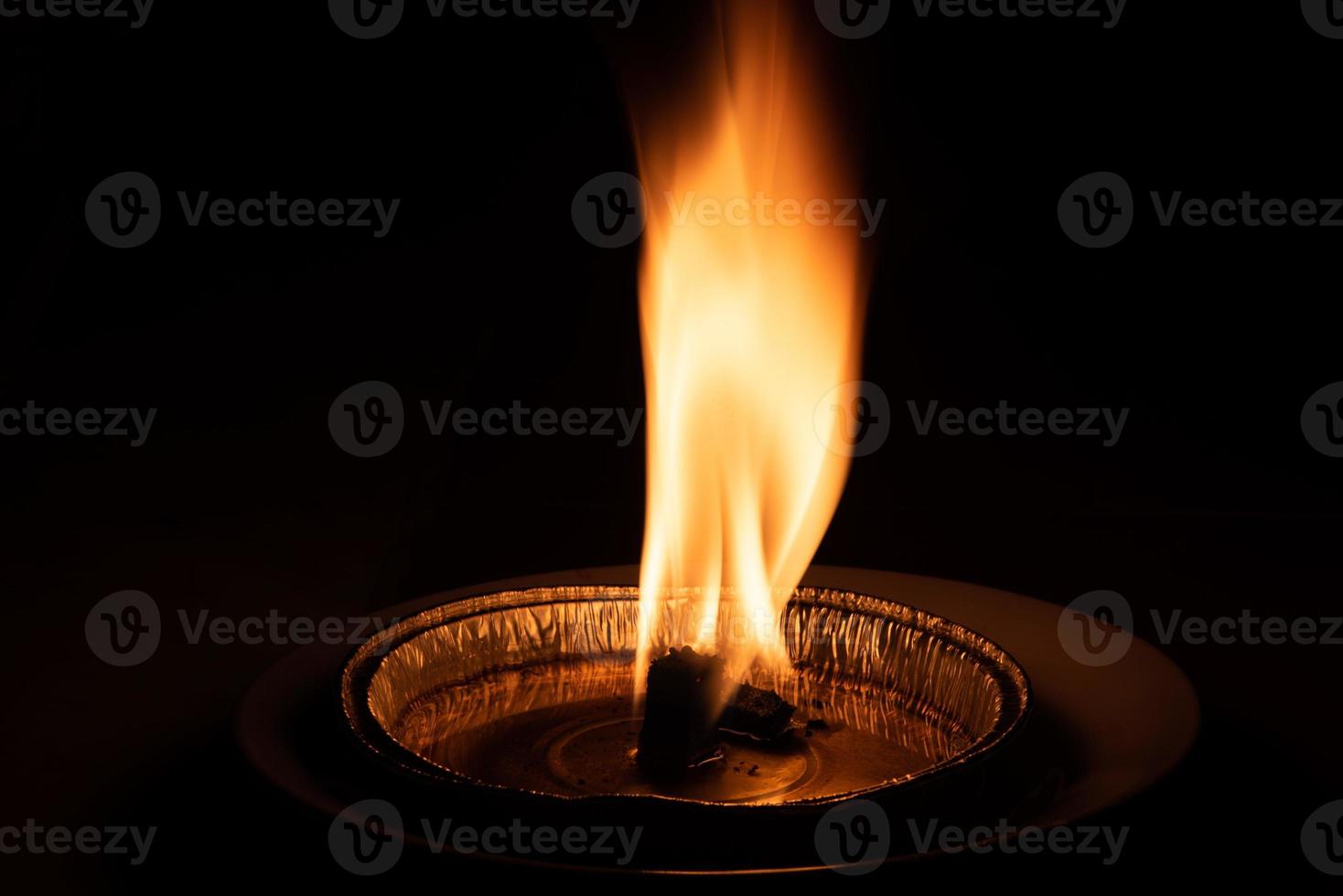 red flame on black background photo