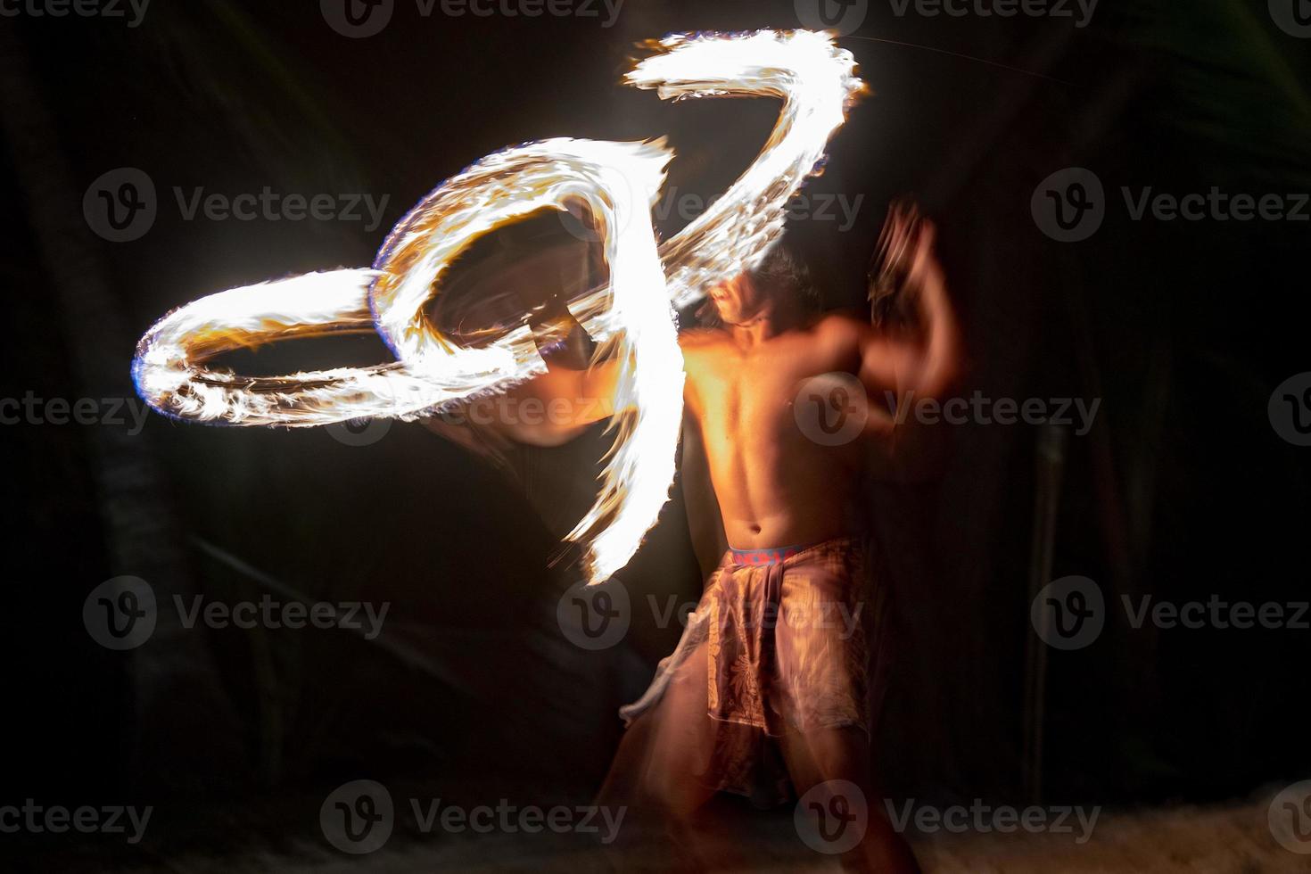 Cook Islands polynesian dancer flames isolated on black photo