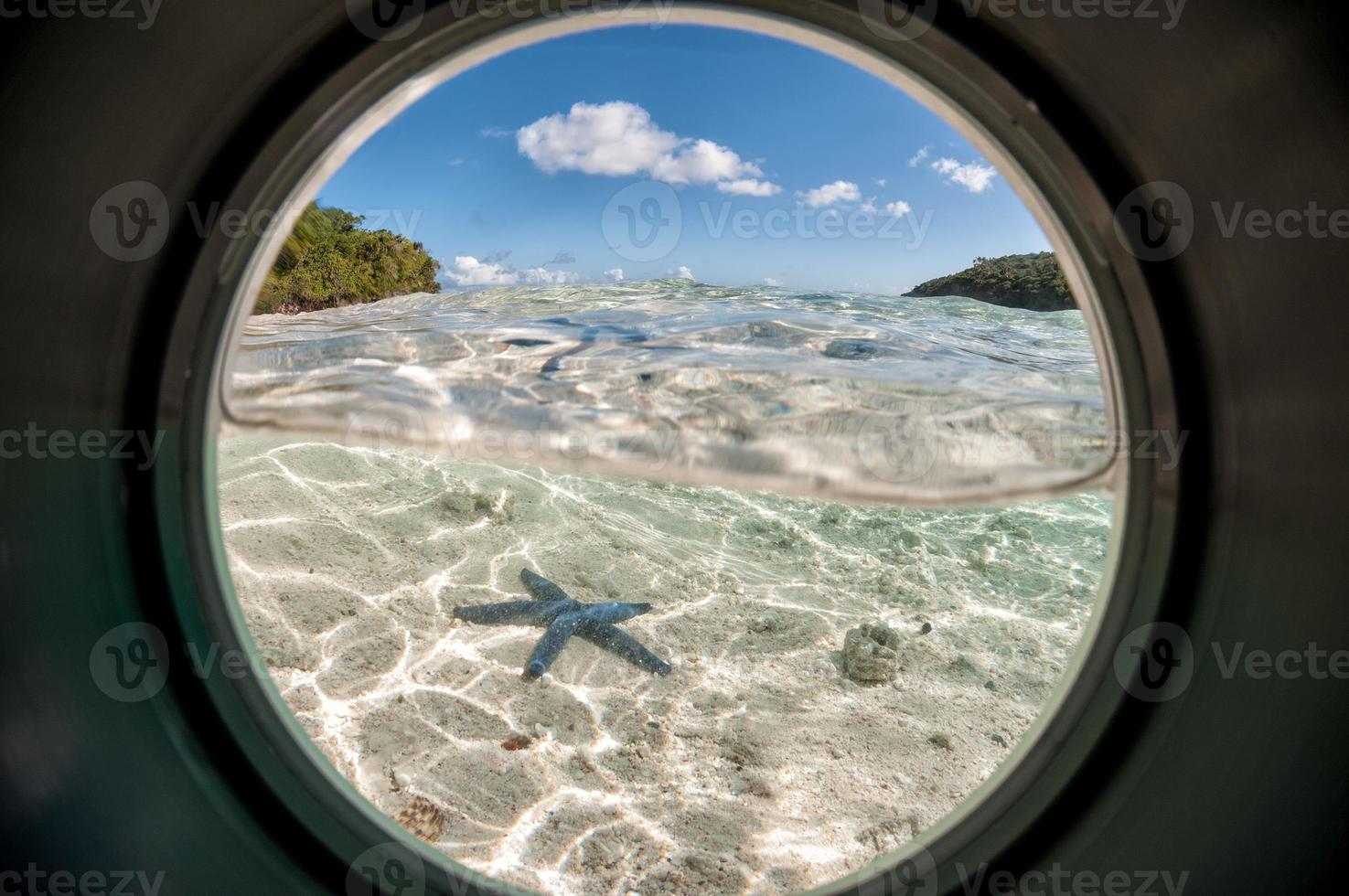 underwater view from porthole in tonga Polynesia photo