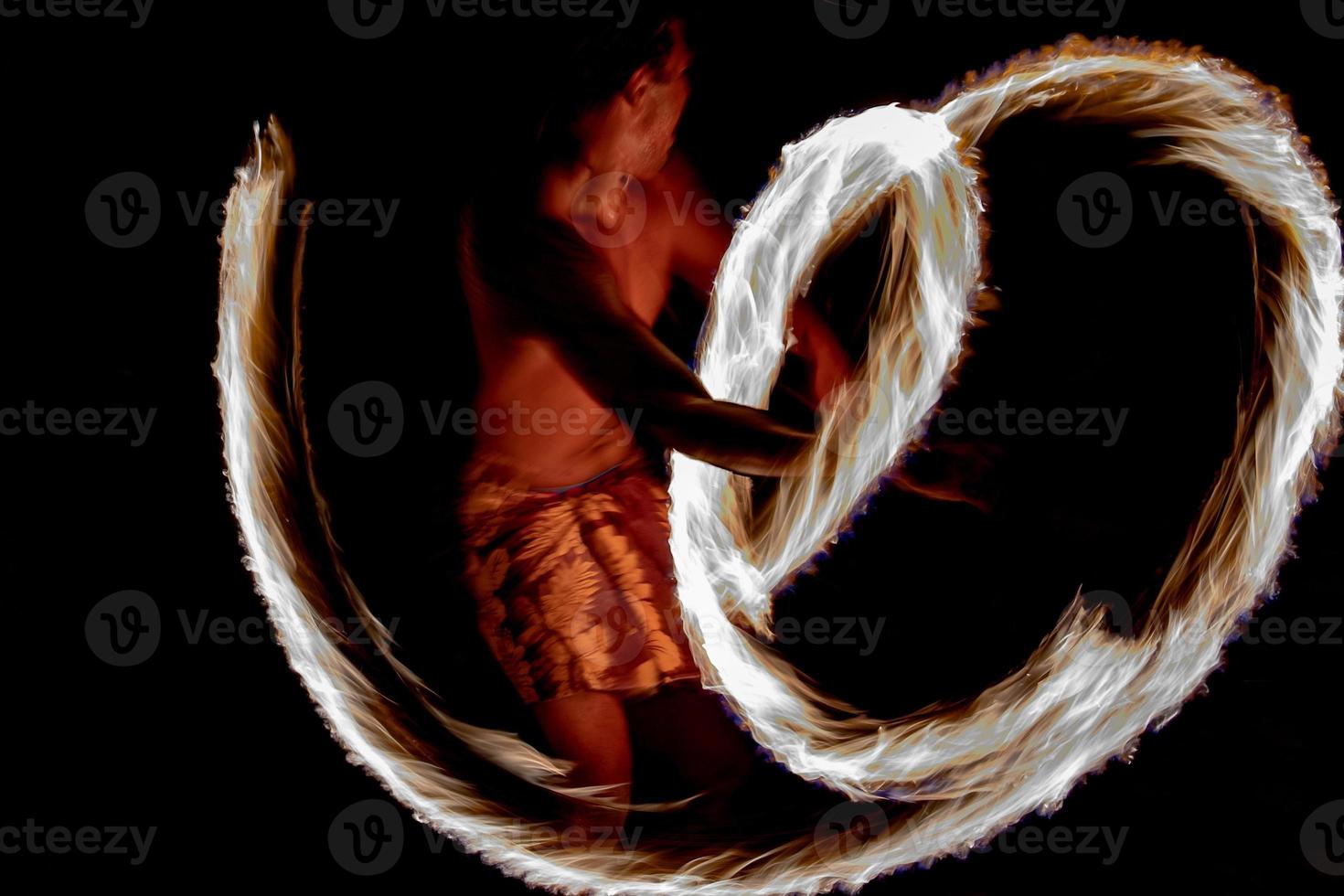 Cook Islands polynesian dancer flames isolated on black photo