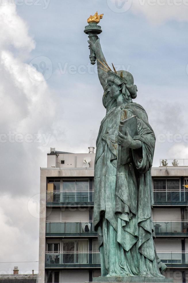 Paris Statue of liberty on river photo