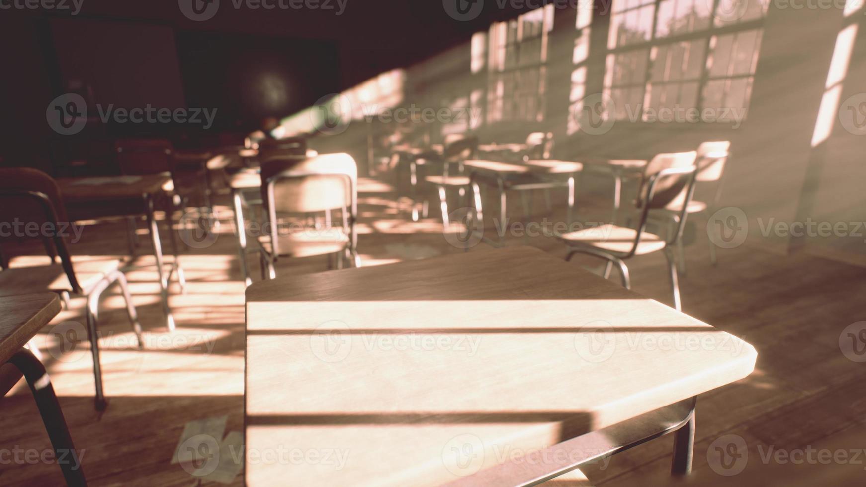 View to classroom with tables and small blackboard and grungy walls photo