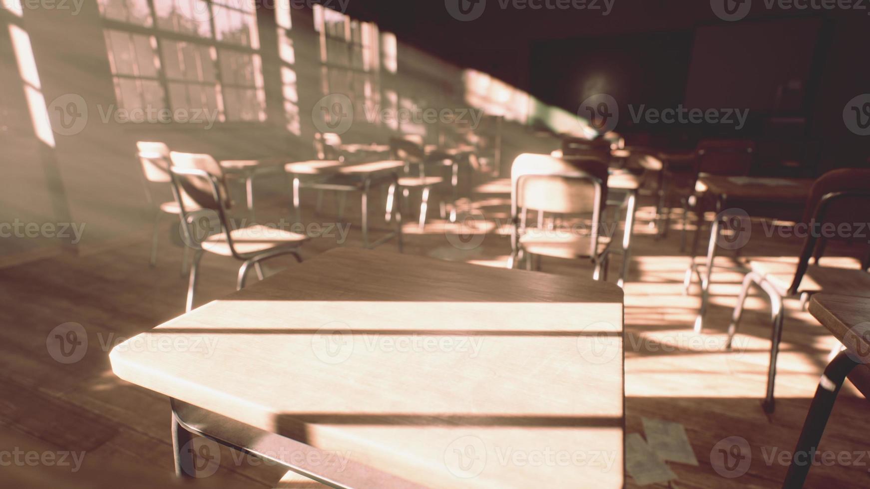 View to classroom with tables and small blackboard and grungy walls photo