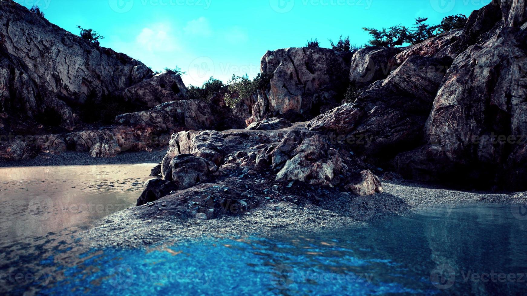 Galapagos volcanic rock formation in ocean photo