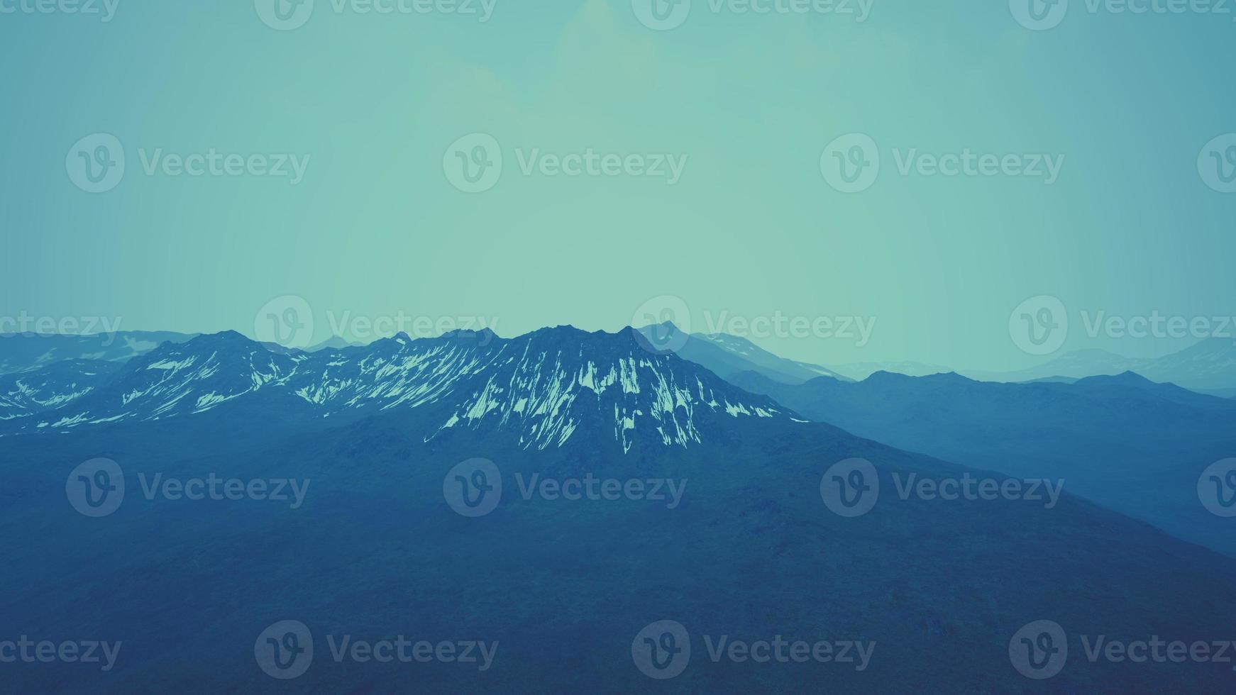 mountains are hidden in low clouds and fog photo