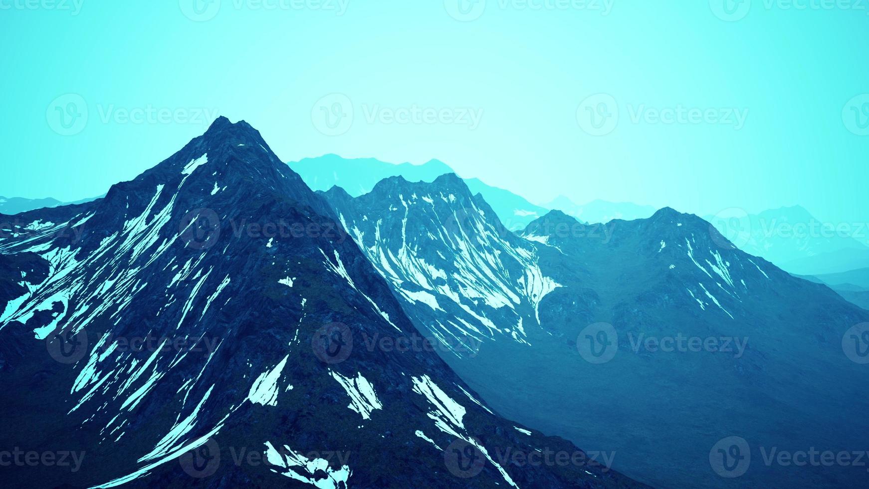 Fog over high mountain peak photo