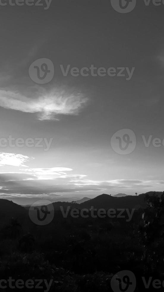landscape vertical picture, white cloud vintage sky, daylight top view high tree, with mountain background around countryside. Thailand. photo